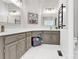 Bathroom with double sinks, gray cabinets, and modern fixtures at 5015 Foxbriar Trl, Charlotte, NC 28269