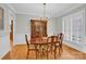 Formal dining room with hardwood floors, chandelier, and shuttered windows at 5015 Foxbriar Trl, Charlotte, NC 28269