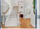 Welcoming foyer featuring a staircase and hardwood floors at 5015 Foxbriar Trl, Charlotte, NC 28269