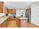 Spacious kitchen featuring stainless steel appliances, granite countertops, and an island cooktop at 5015 Foxbriar Trl, Charlotte, NC 28269