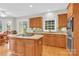 Bright kitchen featuring an island cooktop, granite counters, and ample cabinet space at 5015 Foxbriar Trl, Charlotte, NC 28269