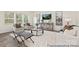 Bright living room features hardwood floors, a large window for natural light, and tastefully coordinated décor at 6017 Santee River Way # 40, Belmont, NC 28012