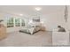 Spacious main bedroom with large windows, plush carpeting, neutral tones, and comfortable seating for a relaxing retreat at 6017 Santee River Way # 40, Belmont, NC 28012