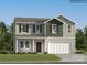 Two-story home featuring mixed siding, a covered porch, and an attached two-car garage at 6391 Fairfax Ct, Maiden, NC 28650