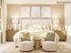 Bright bedroom featuring chairs, neutral tones, lamps, and decorative pillows at 6448 Fairfax Ct, Maiden, NC 28650