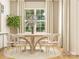 Bright dining area with neutral walls, wood flooring, with a view of backyard and light table at 6448 Fairfax Ct, Maiden, NC 28650