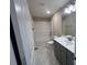 Full bathroom with tub, white tile surround and a stylish modern vanity at 707 Marion Dr, Matthews, NC 28105