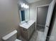 Bathroom featuring modern vanity with granite countertop and tile floors at 707 Marion Dr, Matthews, NC 28105