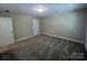 Neutral paint and carpet offer a blank canvas to make this carpeted bedroom your own at 707 Marion Dr, Matthews, NC 28105
