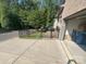 Brick home includes a spacious driveway, a 2-car garage, and charming fenced-in brick patio at 707 Marion Dr, Matthews, NC 28105