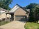 Home exterior showcasing an attached garage with a concrete driveway and well-maintained lawn at 707 Marion Dr, Matthews, NC 28105