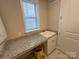 Functional mud room with granite countertop, a sink and cabinet storage at 707 Marion Dr, Matthews, NC 28105