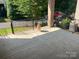 Concrete patio has a black metal fence and plenty of room for outdoor furniture at 707 Marion Dr, Matthews, NC 28105