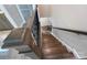 Classic staircase with wood treads and wrought iron railings at 707 Marion Dr, Matthews, NC 28105