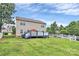 Large backyard with deck and white picket fence offers outdoor living space at 902 Silverberry St, Gastonia, NC 28054