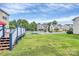 Spacious backyard with newly built deck and charming white fence at 902 Silverberry St, Gastonia, NC 28054