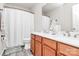 Bright bathroom features double sink vanity, a shower, and a toilet at 902 Silverberry St, Gastonia, NC 28054