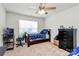 Inviting bedroom with a ceiling fan and large window for natural light at 902 Silverberry St, Gastonia, NC 28054