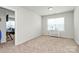 Comfortable bedroom featuring a neutral color scheme and bright natural light from the window at 902 Silverberry St, Gastonia, NC 28054