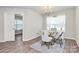 Charming dining area with a stylish table, white curtains, and sliding door access at 902 Silverberry St, Gastonia, NC 28054