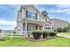 Beautiful two-story home with a well-kept lawn, front porch, and lovely landscaping at 902 Silverberry St, Gastonia, NC 28054