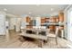 This dining area has lovely views of the kitchen with its stainless steel appliances and natural wood cabinets at 902 Silverberry St, Gastonia, NC 28054