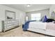 Comfortable main bedroom featuring a stylish dresser, large window, and cozy decor at 902 Silverberry St, Gastonia, NC 28054
