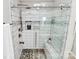 Modern bathroom shower featuring beautiful tile work and glass doors at 902 Silverberry St, Gastonia, NC 28054