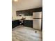 Updated kitchen features stainless steel appliances, dark cabinetry, and modern countertops enhancing the cooking experience at , Salisbury, NC 28146