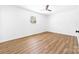Cozy bedroom showcasing laminate flooring, neutral walls and a ceiling fan at 104 Spargo St, Gastonia, NC 28056