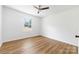 Inviting bedroom offers lots of natural light and lovely dark, wood-look laminate flooring at 104 Spargo St, Gastonia, NC 28056