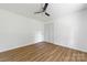 Clean bedroom with a ceiling fan, laminate floors, and a large closet for storage at 104 Spargo St, Gastonia, NC 28056
