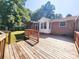 Exterior of house showing a large wooden back deck at 125 Circle Dr, Mount Holly, NC 28120