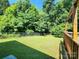 Backyard featuring a well-manicured lawn and mature trees at 125 Circle Dr, Mount Holly, NC 28120