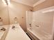 A well lit bathroom featuring a shower/tub combo and a single sink vanity at 125 Circle Dr, Mount Holly, NC 28120