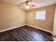 Standard bedroom features a ceiling fan, neutral walls, and a single window at 125 Circle Dr, Mount Holly, NC 28120