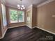 Dining area featuring hardwood floors, and windows bringing in ample light at 125 Circle Dr, Mount Holly, NC 28120