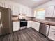 Well-lit kitchen features stainless steel appliances, stylish counters, and ample white cabinetry at 125 Circle Dr, Mount Holly, NC 28120