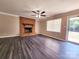 Comfortable living area features a brick fireplace, ceiling fan, and lots of space at 125 Circle Dr, Mount Holly, NC 28120