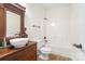 Charming bathroom with decorative vanity, bowl sink, and a well-lit bathtub and shower combo at 1730 Townsend Ln, Rock Hill, SC 29730