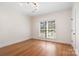 Bright bedroom featuring hardwood floors, a large window, and neutral walls for a peaceful ambiance at 1730 Townsend Ln, Rock Hill, SC 29730