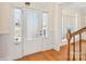 Bright entryway featuring a front door, hardwood floors, and decorative trim at 1730 Townsend Ln, Rock Hill, SC 29730