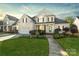 Charming two-story home featuring a well-manicured lawn and inviting curb appeal at 1730 Townsend Ln, Rock Hill, SC 29730