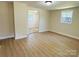 Open-concept living area showcasing updated floors and neutral wall colors, perfect for modern living at 20016 Walter Henderson Rd, Cornelius, NC 28031