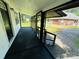 Spacious screened-in front porch with ample room for outdoor seating at 20016 Walter Henderson Rd, Cornelius, NC 28031