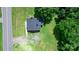 Aerial view of a quaint home surrounded by lush greenery and trees at 2704 Kool Park Ne Rd, Hickory, NC 28601