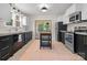 Modern kitchen with sleek black and white cabinetry, stainless steel appliances, and a center island at 2704 Kool Park Ne Rd, Hickory, NC 28601