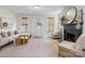 Bright living room with neutral decor, fireplace, large windows, and hardwood floors creating a cozy atmosphere at 2704 Kool Park Ne Rd, Hickory, NC 28601