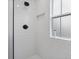 Close-up of shower features white subway tile, black fixtures, and a shower niche at 2704 Kool Park Ne Rd, Hickory, NC 28601