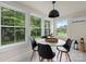 Bright sunroom with large windows, a modern pendant light and tiled flooring creating a relaxing space at 2704 Kool Park Ne Rd, Hickory, NC 28601